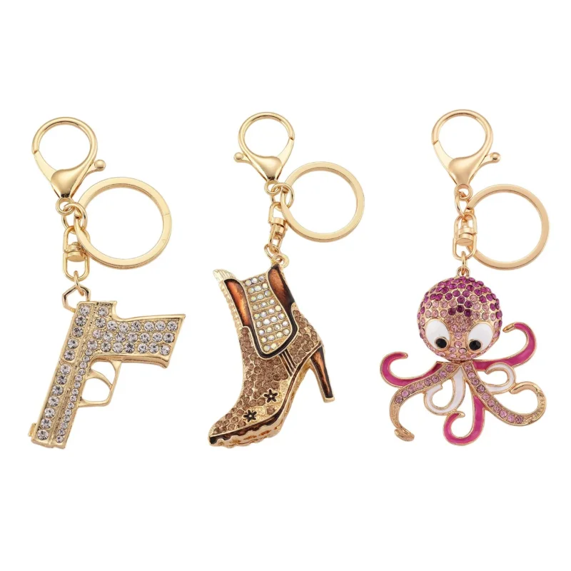 3er-Set emaillierte weiße und mehrfarbige Kristall-Schlüsselanhänger, Pistole, Stiefelette und Oktopus, Legierung in Gelbgold